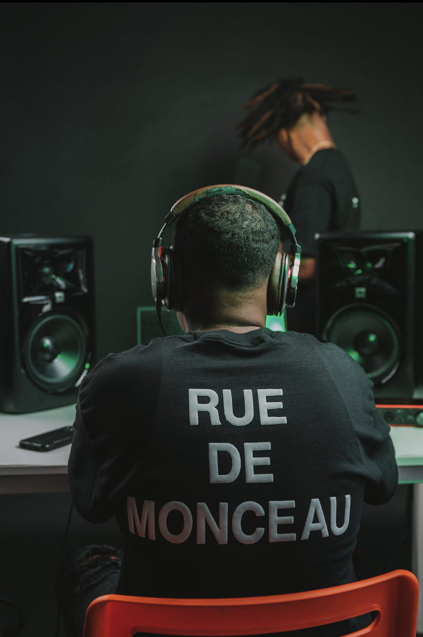 AB at the mixing desk, green-lit monitors